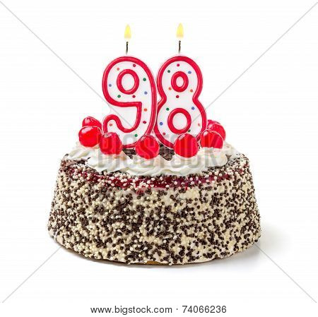 Birthday cake with burning candle number 98
