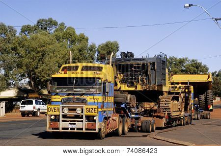 Transporting A Large Dumper Truck On A Road