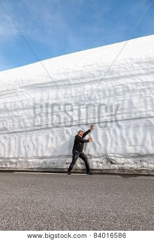 Highway Along The Snow Wall. Norway In Spring