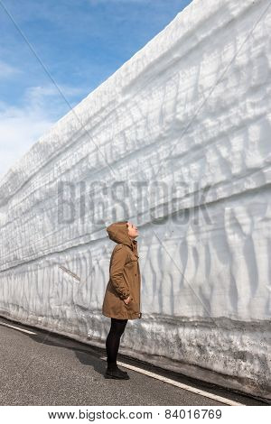 Highway Along The Snow Wall. Norway In Spring