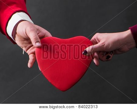 Close Up Of Woman And Man Hands With Heart