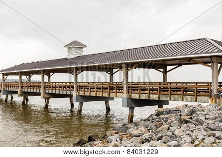 Old Empty Fishing Pier In Winter