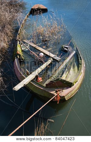 Half Sunken Neglected Steel Rowboat