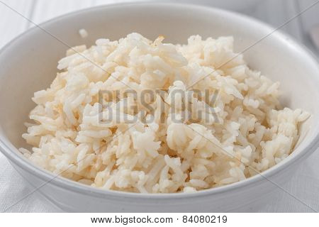 a bowl of rice cooked in chicken stock