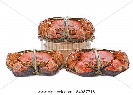 Hairy crabs on the Bamboo steamer Isolated in white background.