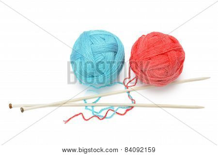 Skeins Of Yarn And Knitting Needles Isolated On A White Background