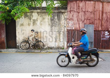 Malaysia, Penang, Georgetown - Circa Jul 2014: Real Bicycle Juxtaposed Over Lifesize Mural Of Childr