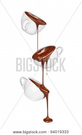 Hot Chocolate Pouring From A Cup In A Cup Isolated On A White Background. Concepts Chocolate Cafe.