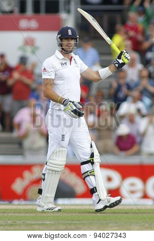 MANCHESTER, ENGLAND - August 03 2013: Kevin Pietersen raises his bat to acknowledge the crowd after scoring 100 runs during day three of  the  Ashes 3rd test match at Old Trafford Cricket Ground