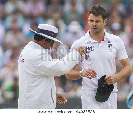NOTTINGHAM, ENGLAND - July 14, 2013: Aleem Dar and James Anderson during day five of the first Investec Ashes Test match at Trent Bridge Cricket Ground on July 14, 2013 in Nottingham, England.