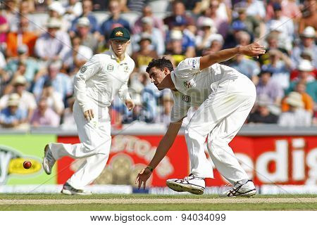 MANCHESTER, ENGLAND - August 02 2013: Chris Rogers and Mitchell Starc during day two of  the Investec Ashes 3rd test match at Old Trafford Cricket Ground, on August 02, 2013 in London, England.