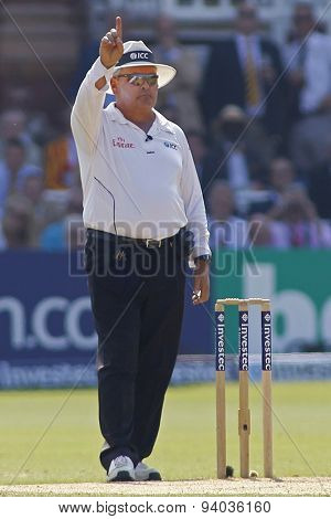 LONDON, ENGLAND - July 21 2013: Umpire Marais Erasmus signals out after reversing his decision after a DRS review during day four of the Investec Ashes 2nd test match, at Lords Cricket Ground
