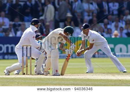 LONDON, ENGLAND - July 21 2013: Usman Khawaja plays a shot and is caught out by James Anderson during day four of the Investec Ashes 2nd test match, at Lords Cricket Ground on July 21