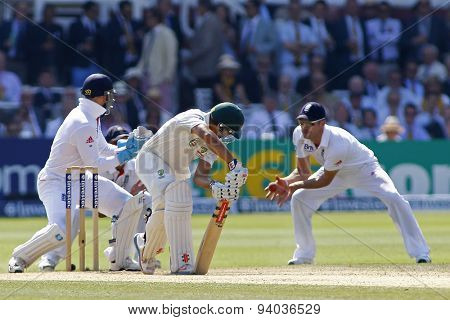 LONDON, ENGLAND - July 21 2013: Usman Khawaja plays a shot and is caught out by James Anderson during day four of the Investec Ashes 2nd test match, at Lords Cricket Ground on July 21, 2013