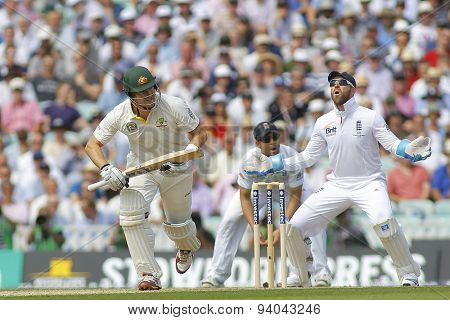 LONDON, ENGLAND - August 21 2013: Shane Watson runs a single as Matt Prior reacts during day one of the 5th Ashes cricket match between England and Australia played at The Kia Oval Cricket Ground