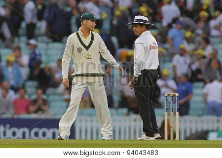 LONDON, ENGLAND - August 22 2013: Michael Clarke has a chat with umpire Aleem Dar after play finished on day two of the 5th Investec Ashes cricket match between England and Australia