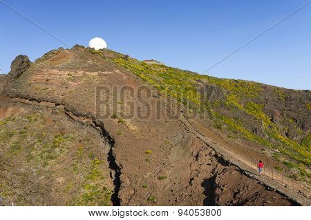 Young girl on the winding mountain trekking path at Pico do Areeiro, Madeira, Portugal
