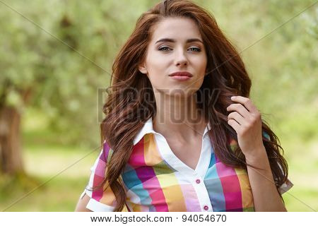 Beautiful woman under an olive tree