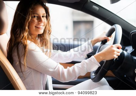 Young woman driving her car