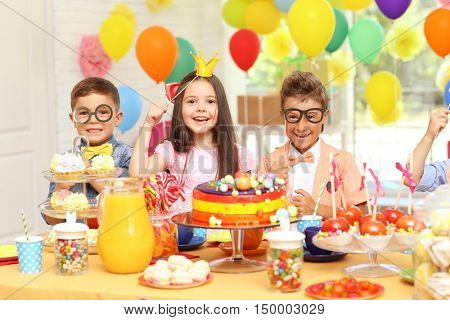 Children's funny birthday party in decorated room