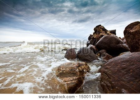 Cape Kolka on the Baltic Sea, near the entry to Gulf of Riga. Dramatic sky and storm in the sea