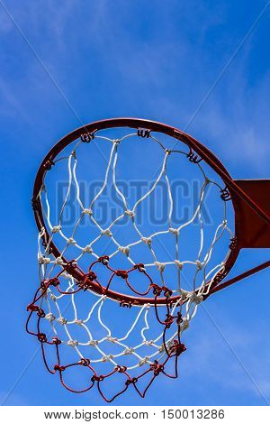 A view of a basketball hoop from below