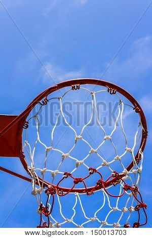 A view of a basketball hoop from below