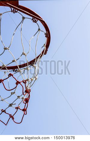 A view of a basketball hoop from below