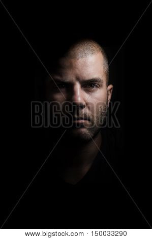 Portrait of young man on a black background