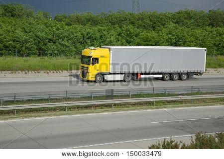 BUDAPEST, HUNGARY - MAY 3, 2016: Truck passing by on Highway M0. The M0 is an important transit ring around Budapest connecting all main motorways of the country.