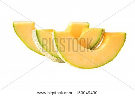 Slices of fresh of Cantaloupe on a white background