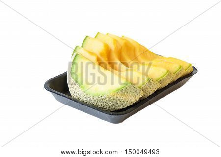 Fresh cantaloup on black tray on white background