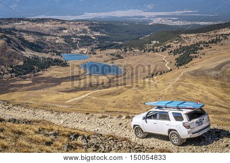 LEADVILLE, CO, USA - SEPTEMBER 27, 2016: Toyota 4Runner SUV (2016 Trail edition) with a paddleboard descending  from the Mosquito Pass on a rocky jeep trail in Colorado's Rocky Mountains
