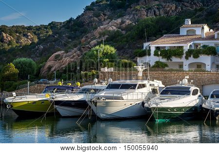 Luxury motor yachts at Poltu Quatu resort marina, Sardinia, Italy.