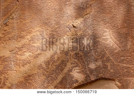 Petroglyph or rock art carvings of Native Americans on a canyon wall in Freemont National Park Capitol Reef Utah USA