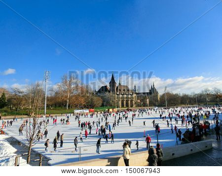 Ice skaters in City Park Ice Rink in Budapest, Hungary. Opened in 1870, it is the largest and one of the oldest ice rinks in Europe.
