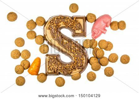 Decorated Chocolate letter with pepernoten and marzipan as Sinterklaas decoration on white background for dutch sinterklaasfeest holiday event on december 5th