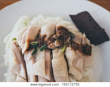 Close up of Hainanese chicken rice with souce.