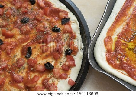pizza alla marinara with fresh chopped tomatoes anchivies and black olives