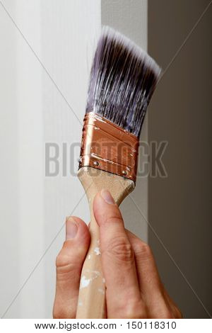 Hand with a paint brush.