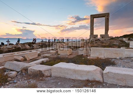 View of Portara and remains of temple of Apollo at sunset.