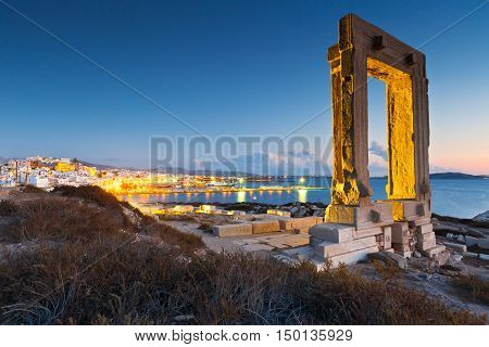 View of Portara and remains of temple of Apollo at sunset.