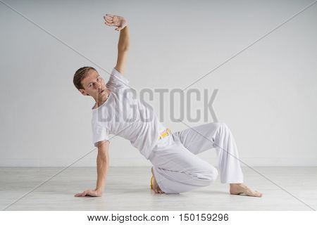 Man practicing Capoeira , brazilian martial Art.