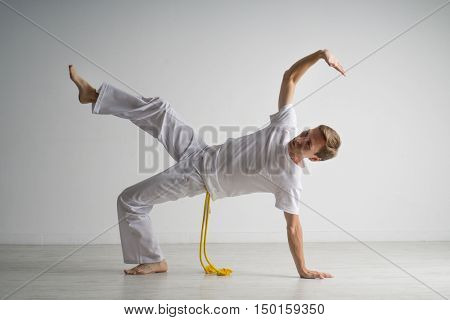 Man practicing capoeira , brazilian martial art.