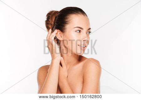 Beauty portrait of a pretty woman with fresh skin standing isolated on a white background
