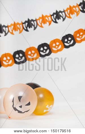 Halloween decoration with sacary balloons and pumpkins and paper bats.