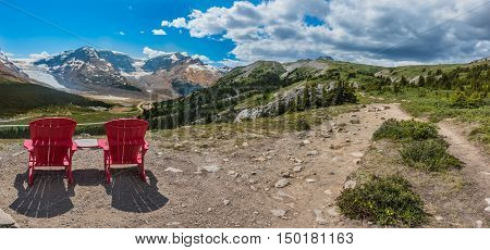Panorama Pair of Red Chairs on the Trail Up to Wilcox Pass with Athabasca Glacier in the background