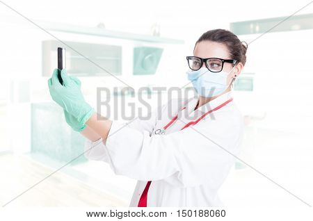 Attractive Young Medic With Smartphone