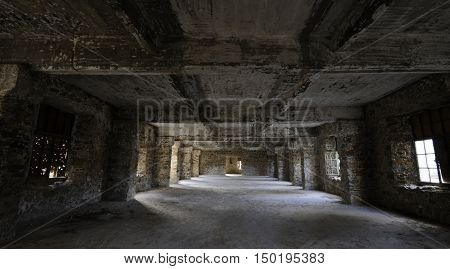 Empty abandoned creepy hotel room with sun lights entering the windows