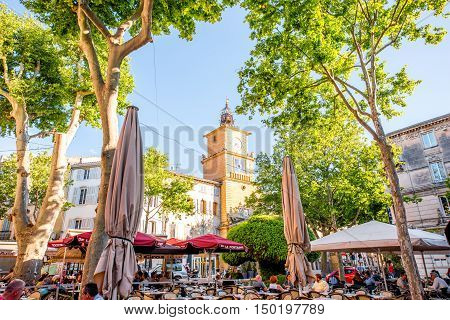 Salon-de-Provence, France - June 17, 2016: View on the central square with cafes, bars and old city gate or clock tower in Salon-de-Provence